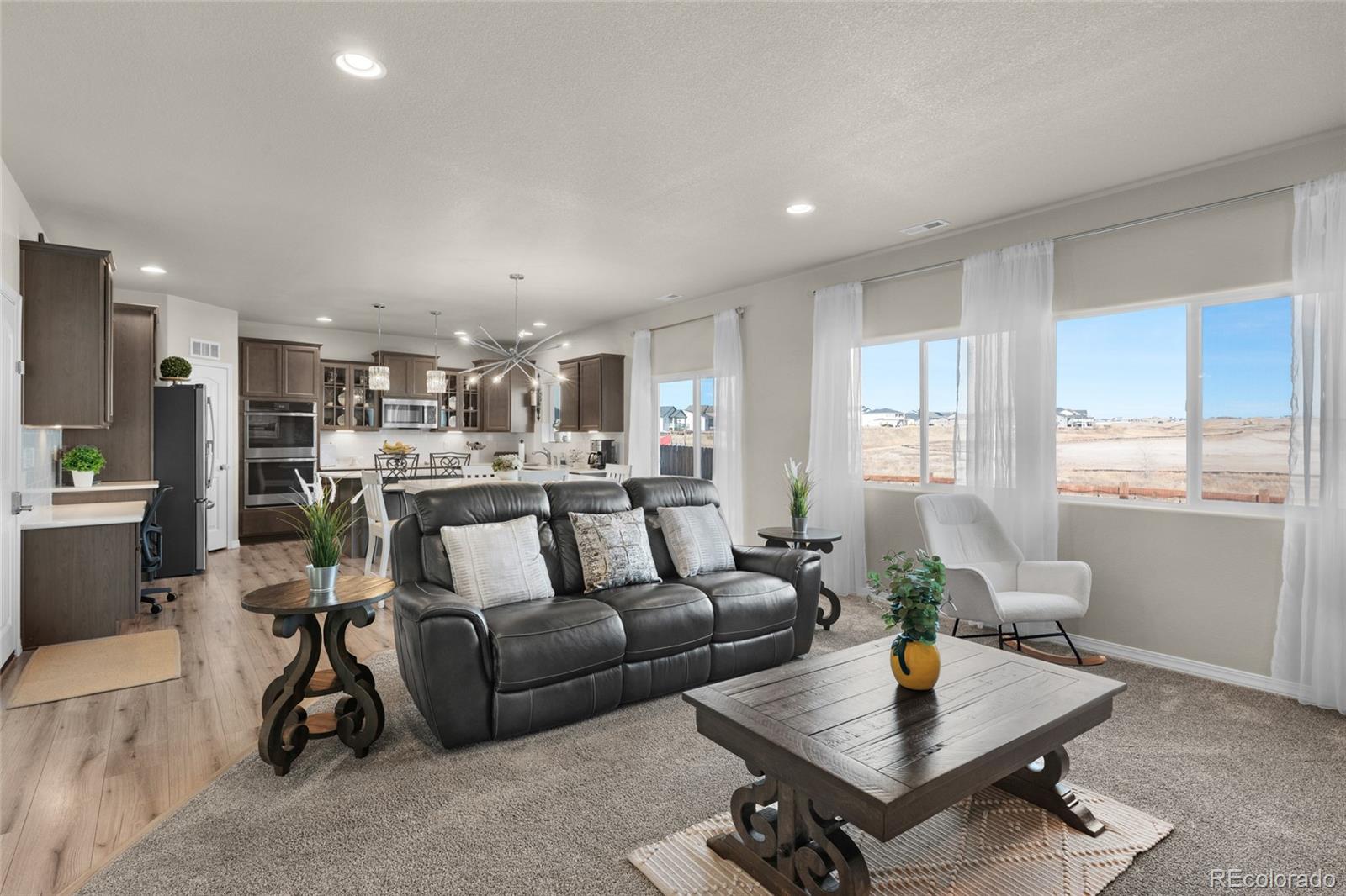 9033 Yellowtail Way Colorado Springs, CO 80908 - Photo 9 of 39 a living room with furniture and a window