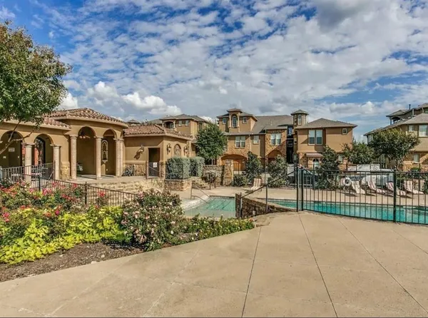 front view of a house with a bench in front of it