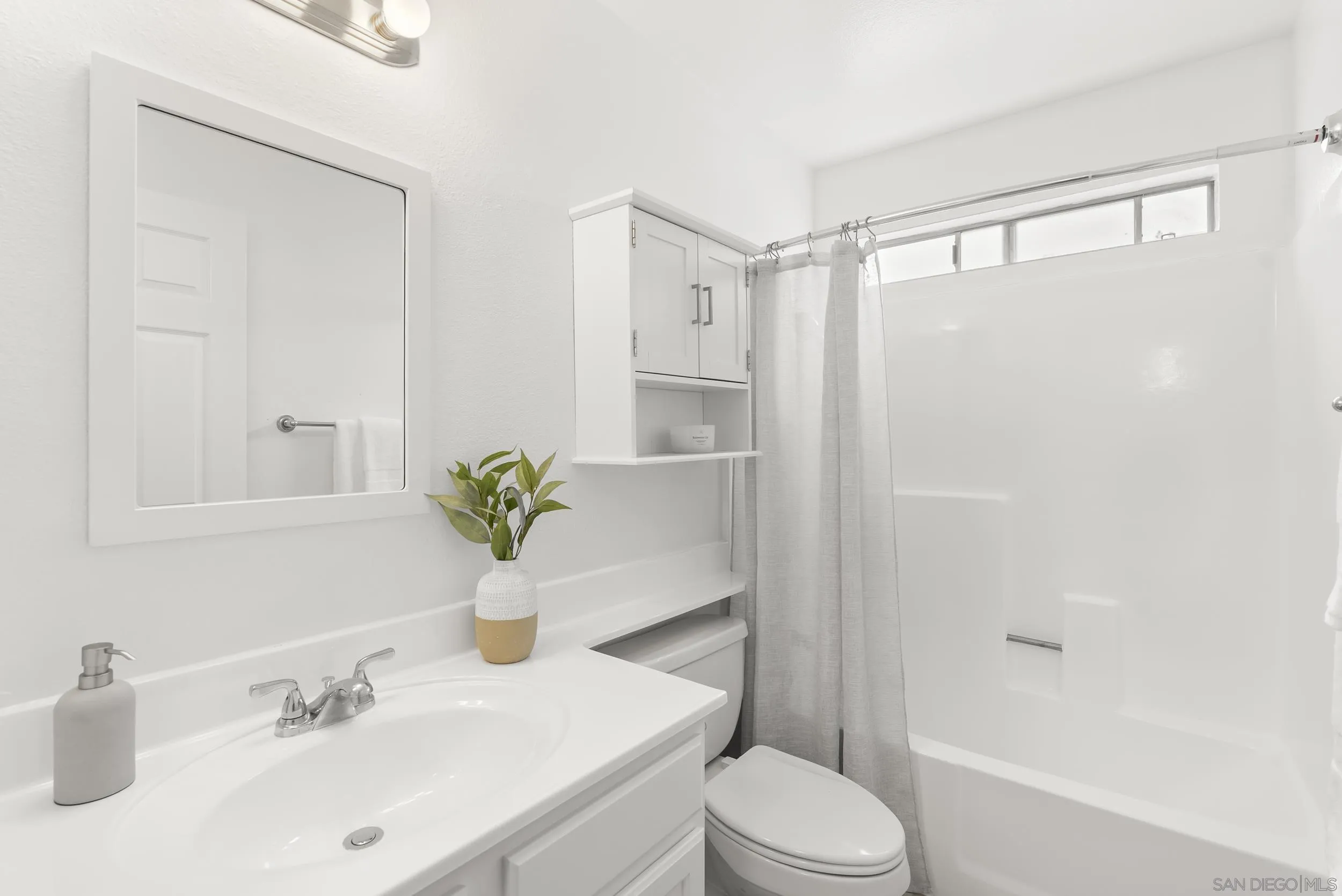830 Broadway, Unit 15 El Cajon, CA 92021 - Photo 16 of 21 a bathroom with a sink toilet and shower
