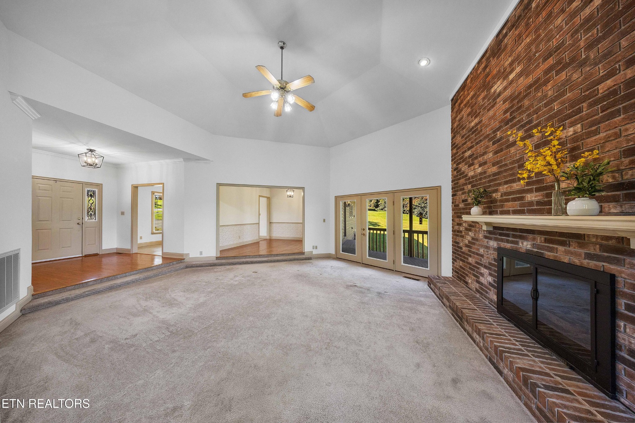 103 Farmington Place Clinton, TN 37716 - Photo 16 of 40 a view of an empty room with window and fireplace