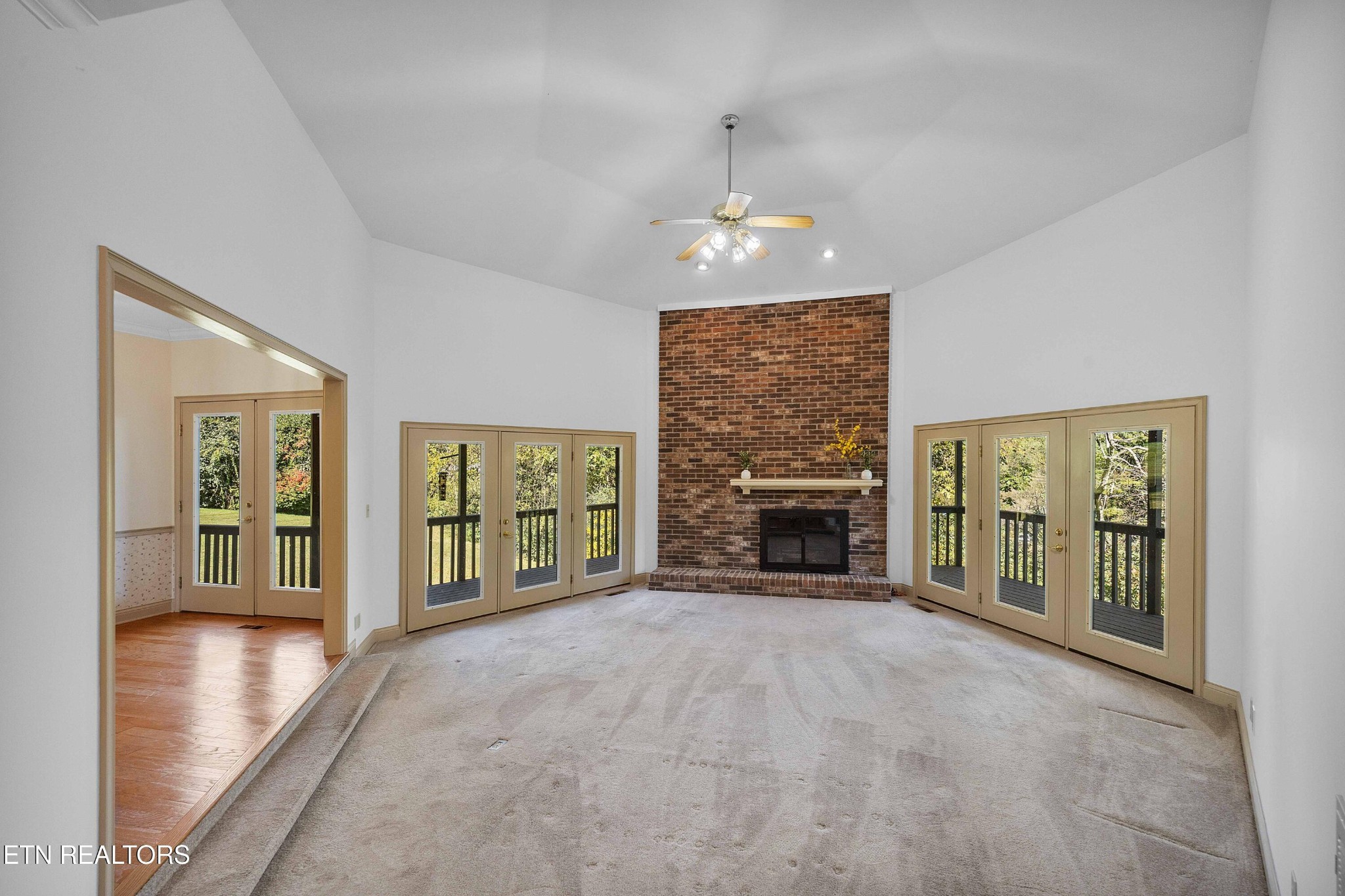 103 Farmington Place Clinton, TN 37716 - Photo 17 of 40 an empty room with furniture and fireplace