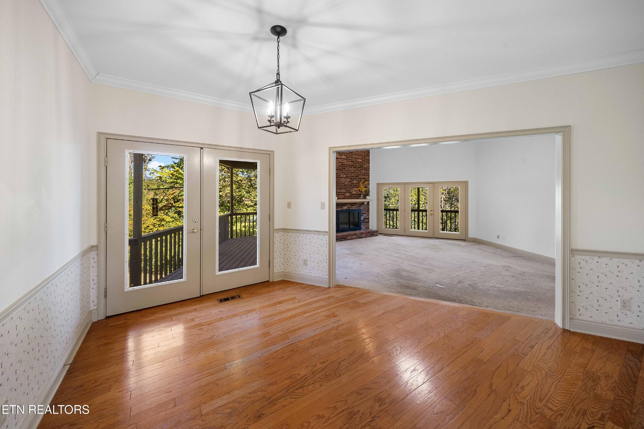 103 Farmington Place Clinton, TN 37716 - Photo 18 of 40 a view of an empty room with a window and wooden floor