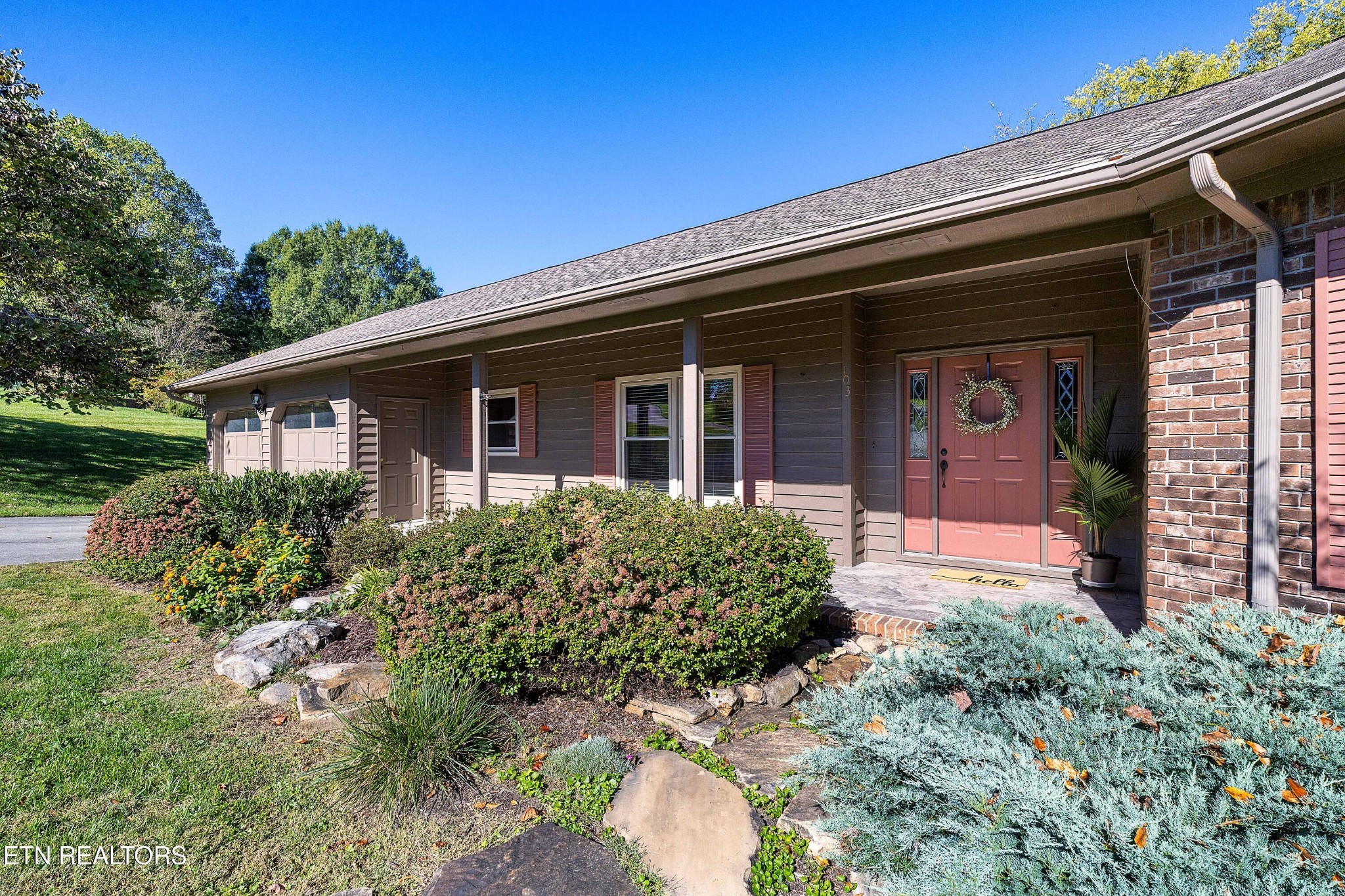 103 Farmington Place Clinton, TN 37716 - Photo 2 of 40 a front view of a house with a yard