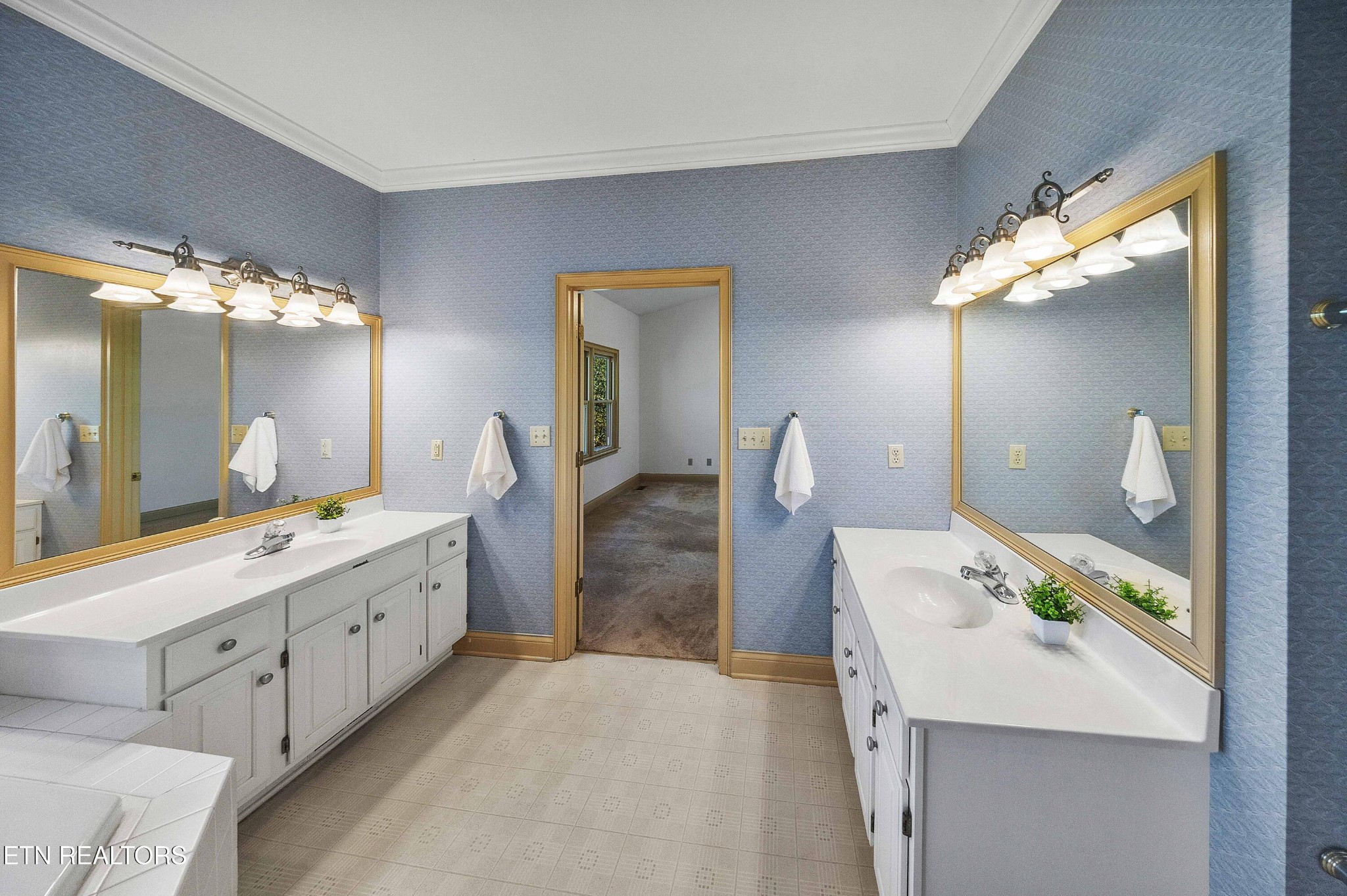 103 Farmington Place Clinton, TN 37716 - Photo 23 of 40 a bathroom with a double vanity sink and a mirror