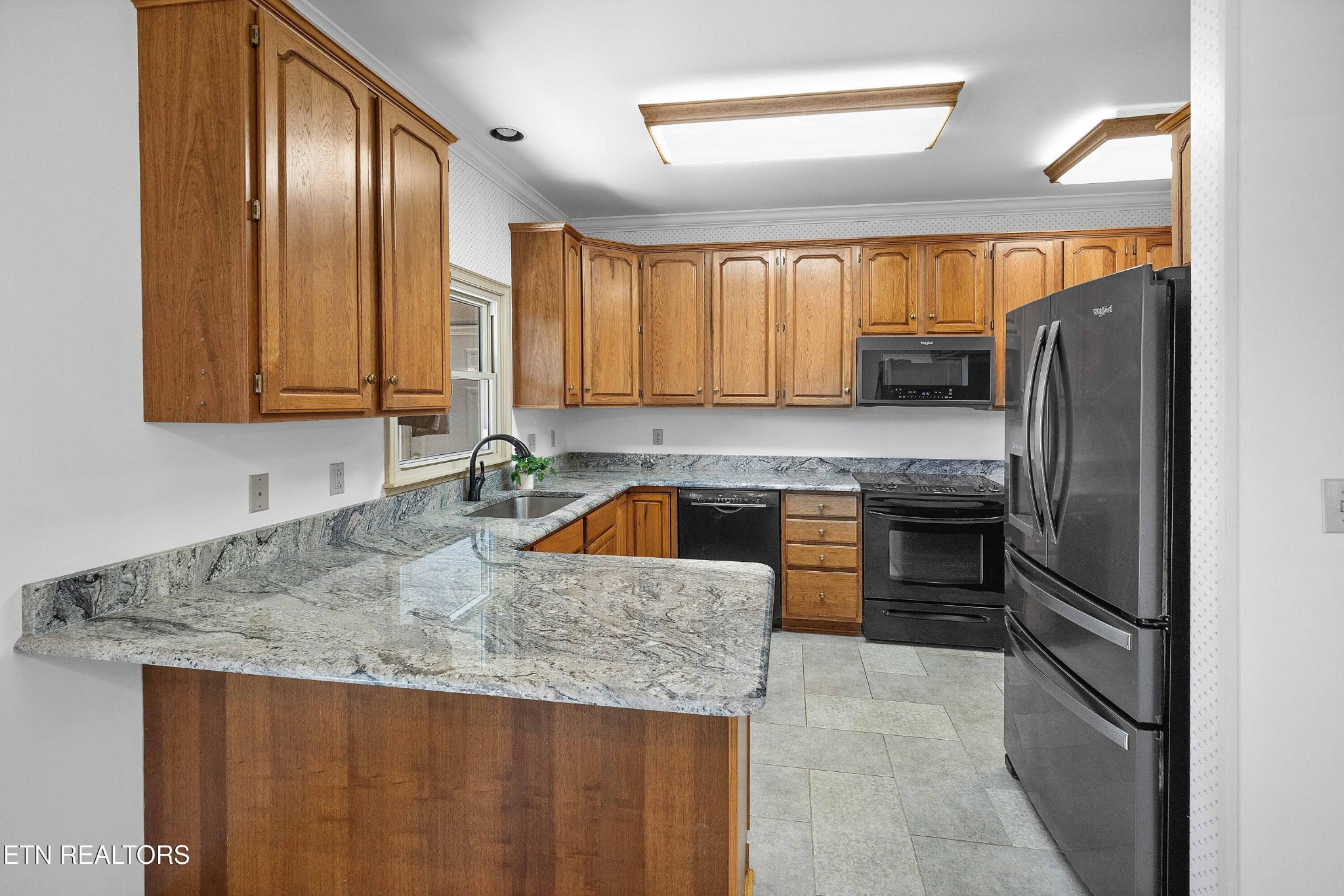 103 Farmington Place Clinton, TN 37716 - Photo 10 of 40 a kitchen with stainless steel appliances granite countertop a refrigerator a stove a sink and dishwasher