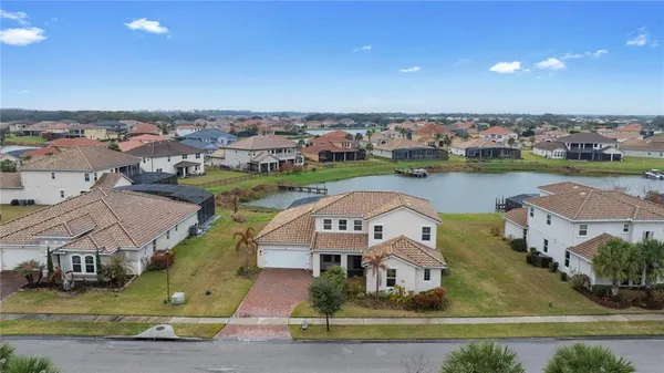 an aerial view of a house with a lake view