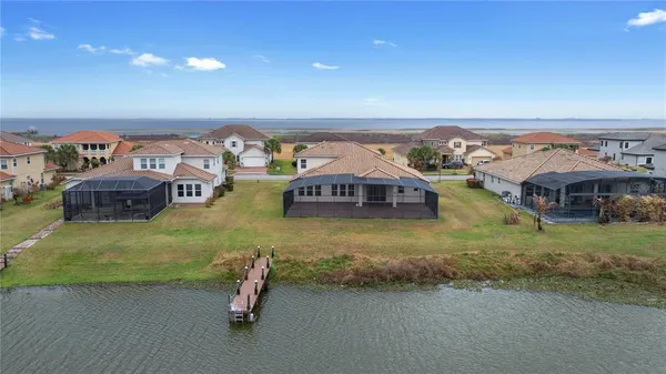 a swimming pool with outdoor seating