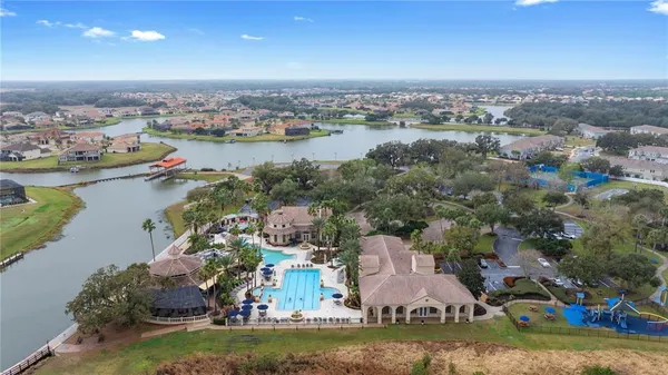 an aerial view of a house with a lake view