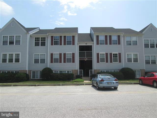 15 Beagle Run, Unit 98 Baltimore, MD 21236 - Photo 1 of 16 a car parked in front of a white building