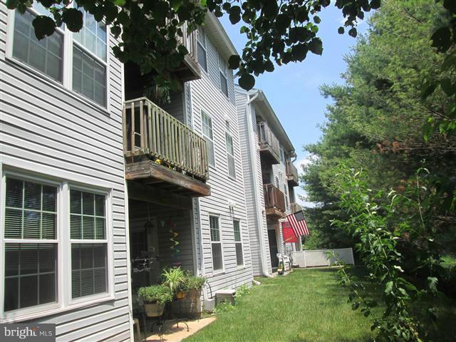 15 Beagle Run, Unit 98 Baltimore, MD 21236 - Photo 2 of 16 a view of a house with a yard and potted plants