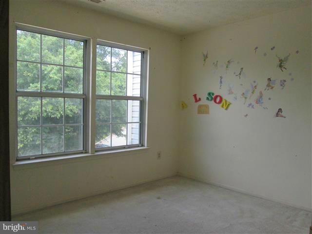 15 Beagle Run, Unit 98 Baltimore, MD 21236 - Photo 11 of 16 a view of an empty room with a window