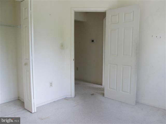 15 Beagle Run, Unit 98 Baltimore, MD 21236 - Photo 12 of 16 an empty room with closet area