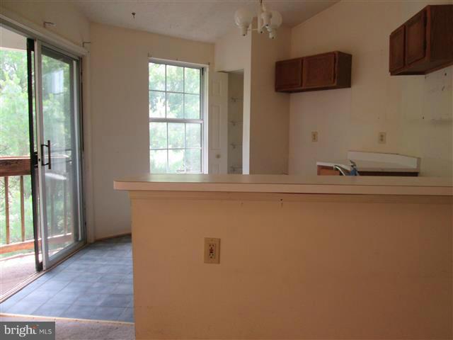 15 Beagle Run, Unit 98 Baltimore, MD 21236 - Photo 6 of 16 a view of a livingroom with furniture and windows