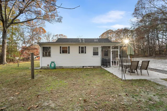 a balcony with furniture and a potted plant