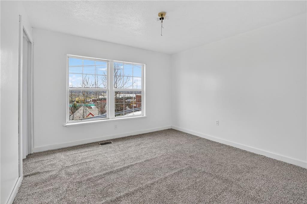 417 Alexander Street McKees Rocks, PA 15136 - Photo 11 of 21 an empty room with windows