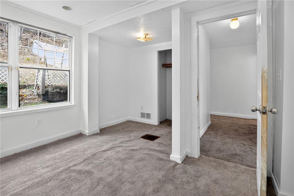 417 Alexander Street McKees Rocks, PA 15136 - Photo 15 of 21 an empty room with windows and closet