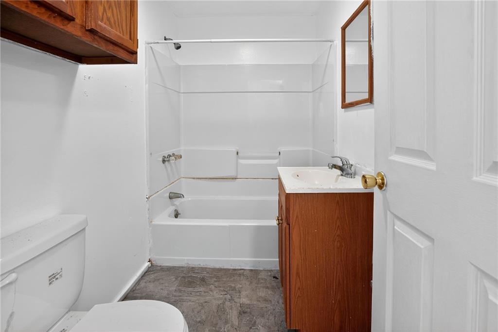 417 Alexander Street McKees Rocks, PA 15136 - Photo 16 of 21 a bathroom with a bathtub and a shower