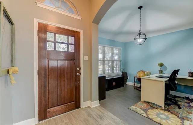 a workspace with furniture and windows