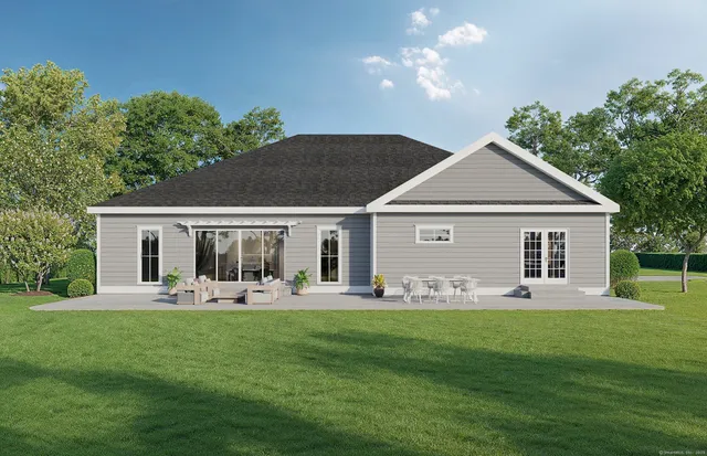 a front view of house with a garden and patio