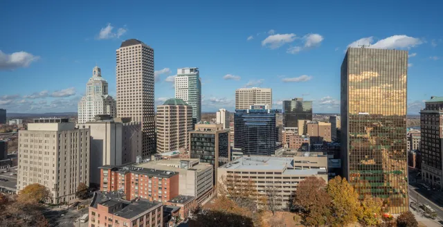 a view of city with tall buildings