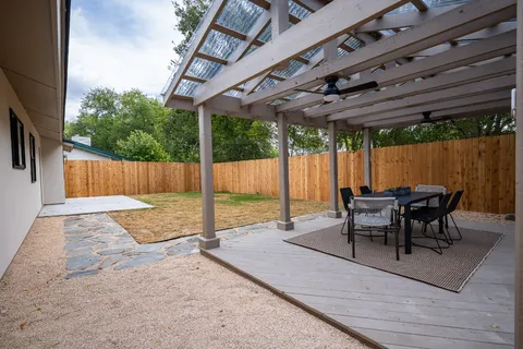 a view of swimming pool with a backyard
