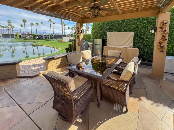 a view of an outdoor sitting area in the backyard