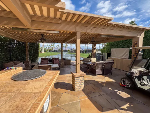 a outdoor space with patio the couches and chairs with wooden floor
