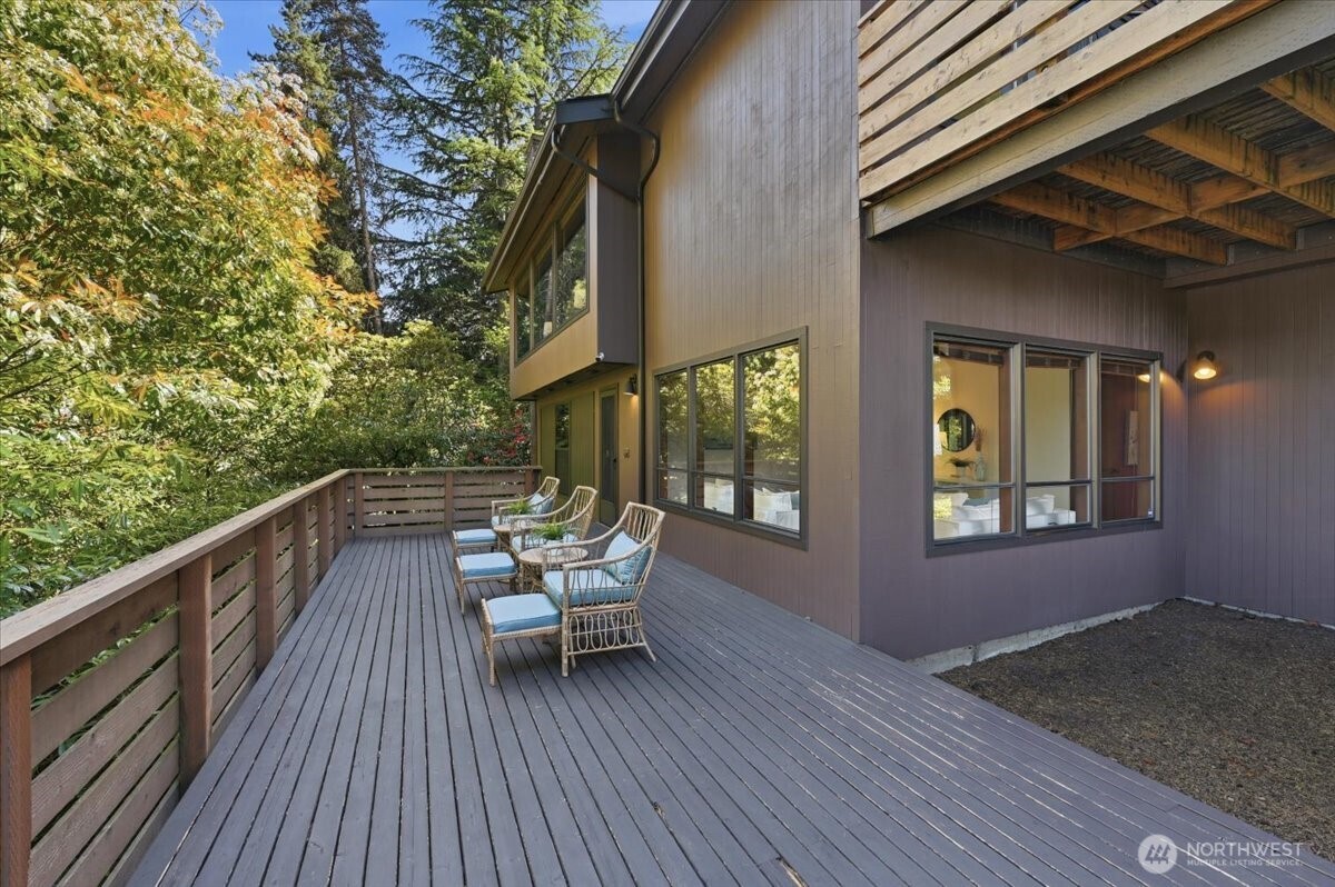 9418 Odin Way Bothell, WA 98011 - Photo 32 of 39 a balcony with wooden floor and outdoor seating