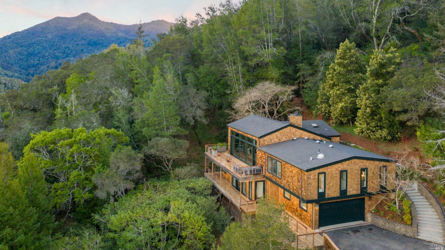 an aerial view of a house with a big yard