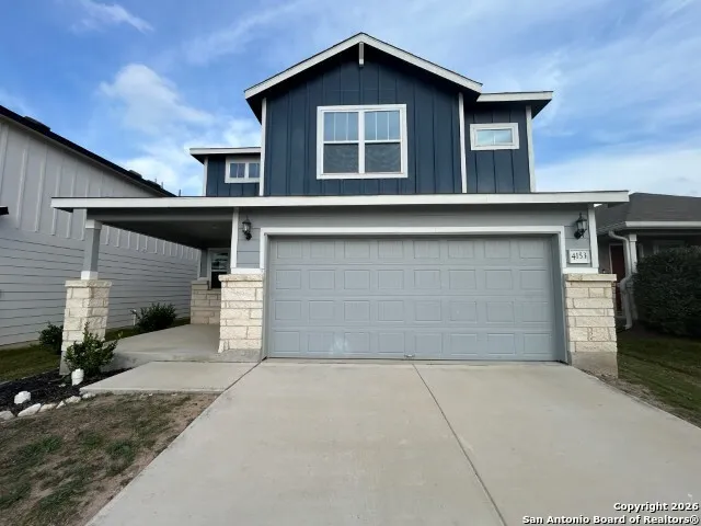 a front view of house with garage