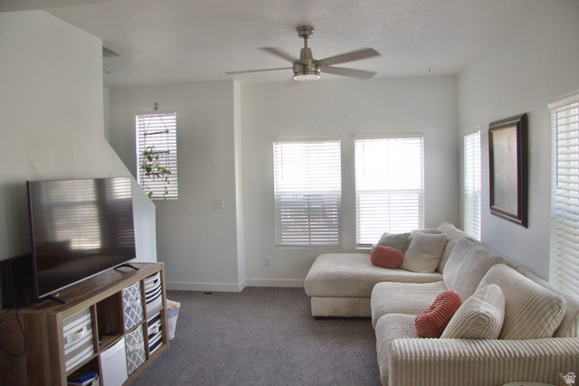 327 West Main Street, Unit 14 Santaquin, UT 84655 - Photo 6 of 20 Carpeted living room featuring baseboards and a ceiling fan