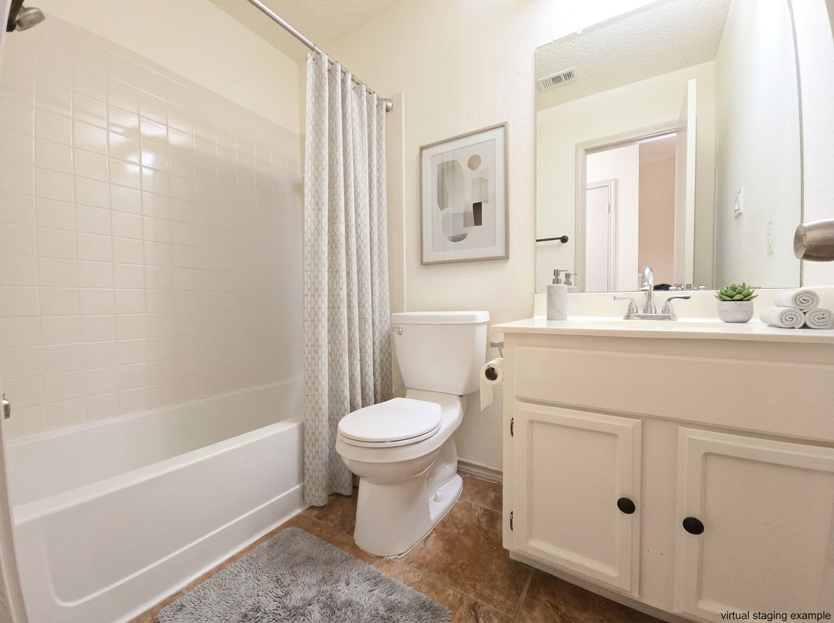 12806 Modena Trail Austin, TX 78729 - Photo 8 of 12 a bathroom with a sink toilet and shower