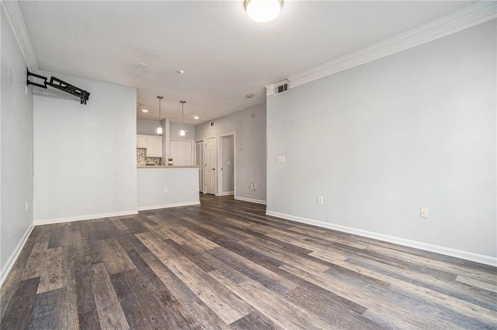 955 Juniper Street Northeast, Unit 3026 Atlanta, GA 30309 - Photo 17 of 32 a view of empty room with wooden floor