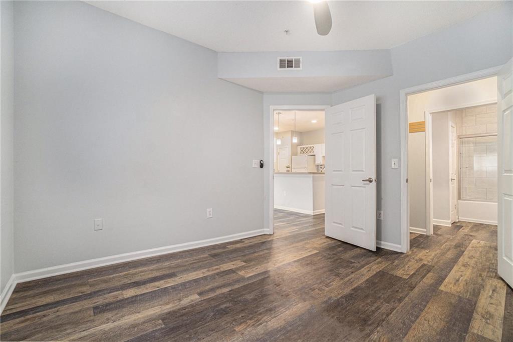 955 Juniper Street Northeast, Unit 3026 Atlanta, GA 30309 - Photo 19 of 32 wooden floor in an empty room