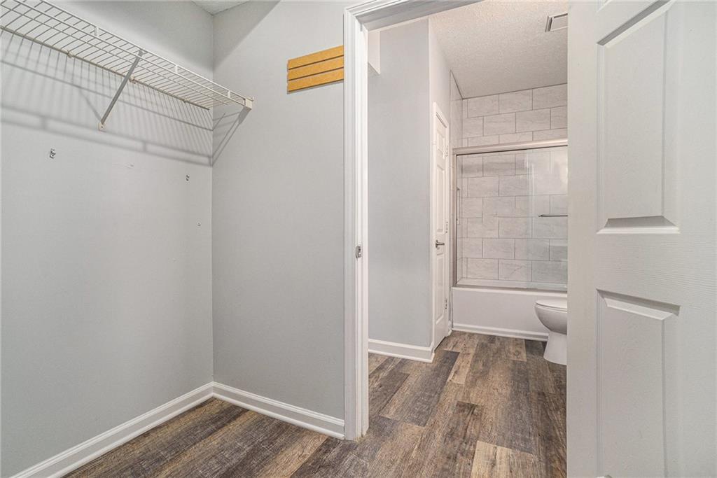 955 Juniper Street Northeast, Unit 3026 Atlanta, GA 30309 - Photo 22 of 32 a view of bathroom with a toilet and a shower
