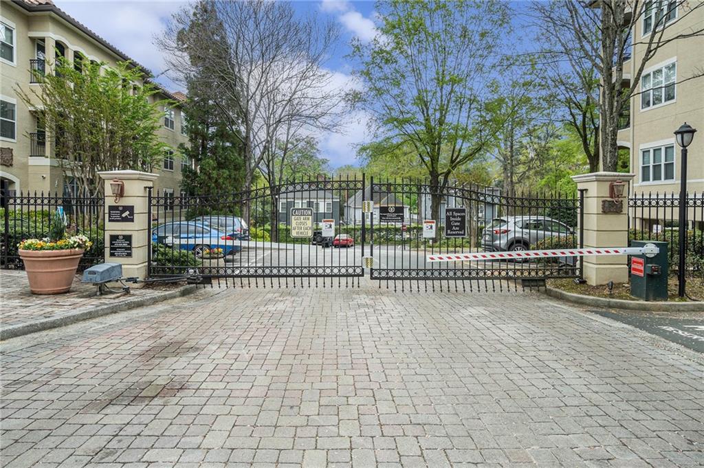 955 Juniper Street Northeast, Unit 3026 Atlanta, GA 30309 - Photo 3 of 32 a view of a wrought iron fences in front of house
