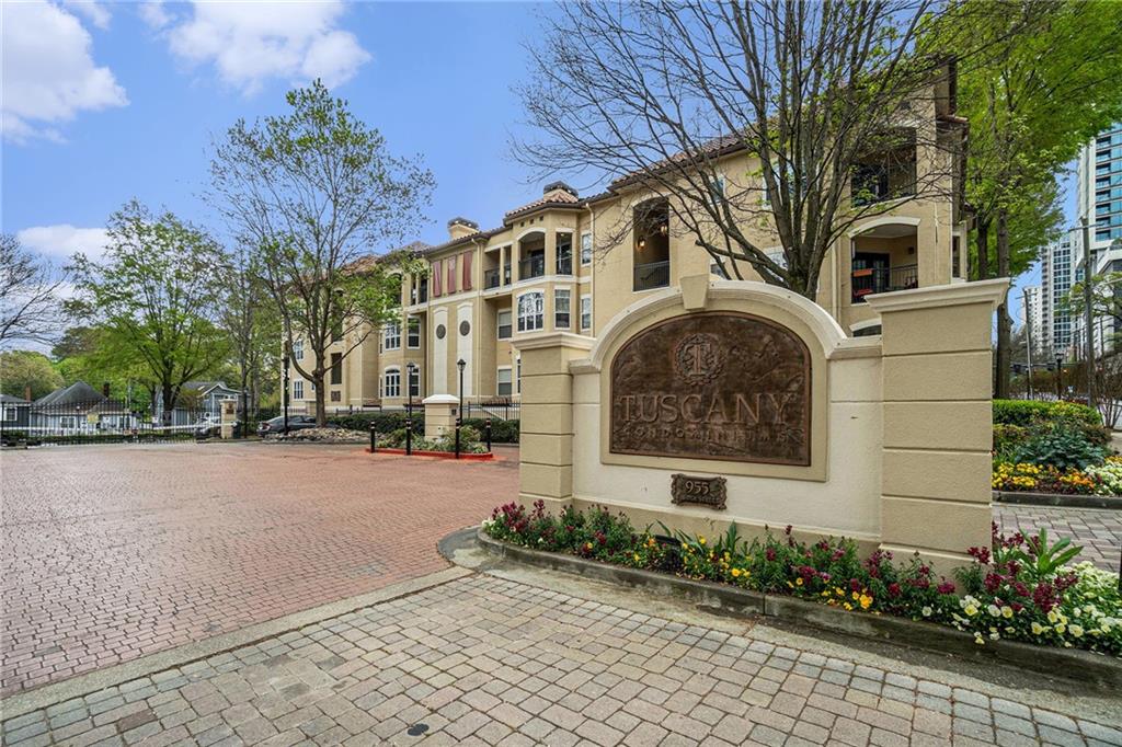 955 Juniper Street Northeast, Unit 3026 Atlanta, GA 30309 - Photo 32 of 32 a front view of a house with a yard