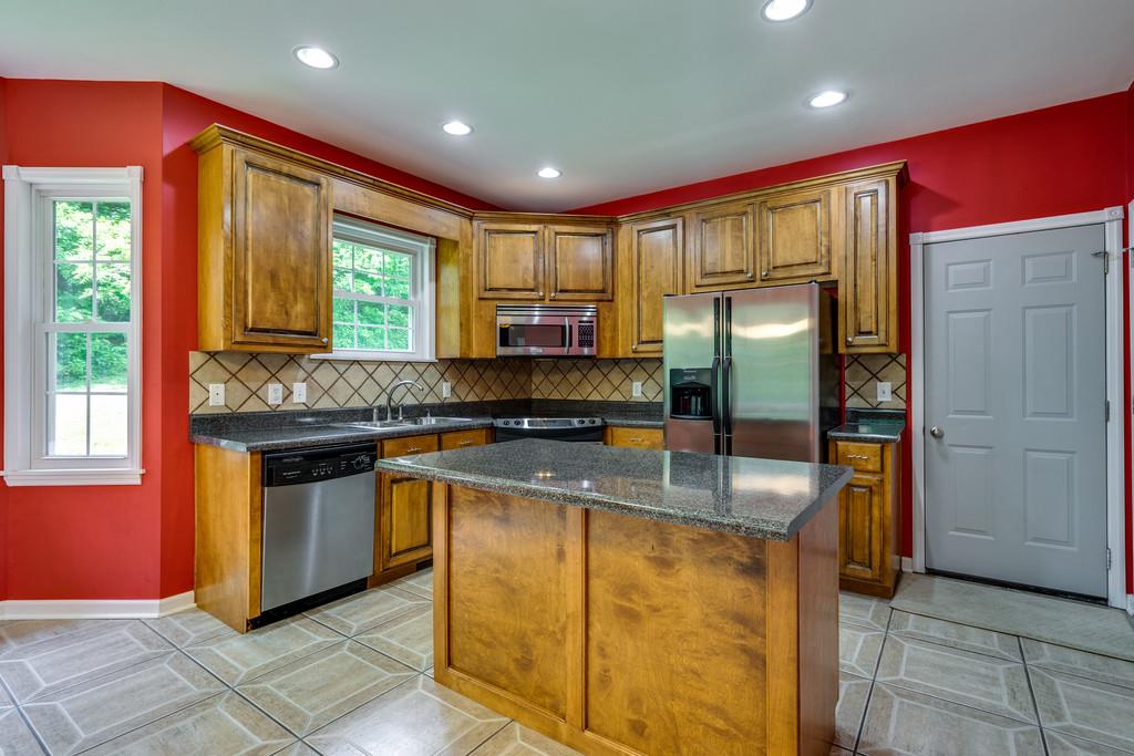 3853 Taylors Store Road Hampshire, TN 38461 - Photo 14 of 30 KITCHEN HAS AWESOME CABINETS FOR STORAGE AND COUNTER TOPS FOR PREP WORK