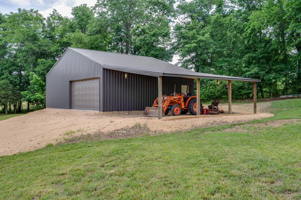 3853 Taylors Store Road Hampshire, TN 38461 - Photo 27 of 30 LARGE SHOP DOOR WITH ROOM IN THE SIDE SHED FOR EQUIPMENT