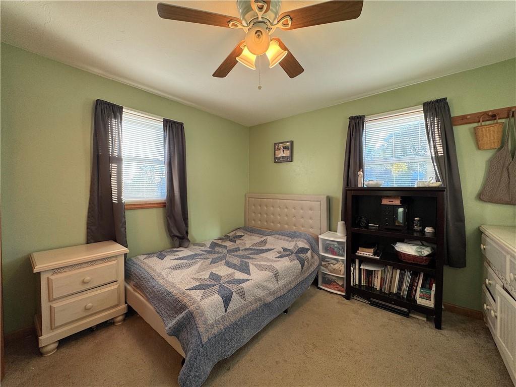 2030 Leo Street Irwin, PA 15642 - Photo 16 of 33 a bedroom with a bed and a chandelier