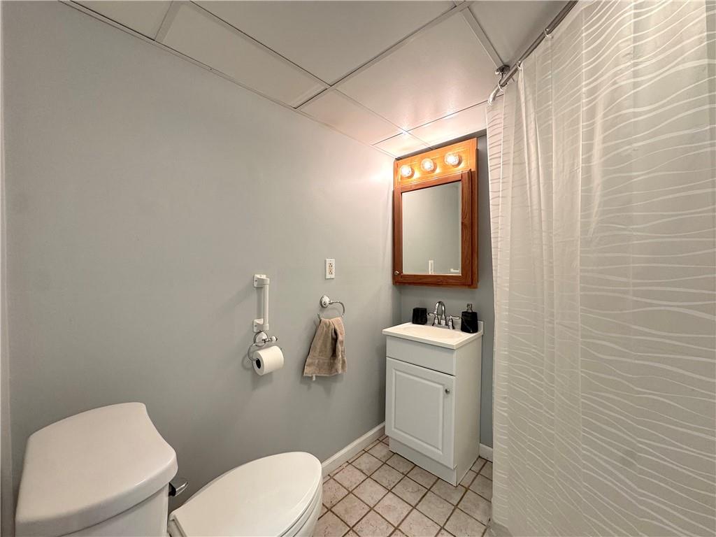 2030 Leo Street Irwin, PA 15642 - Photo 22 of 33 a bathroom with a toilet a sink and mirror