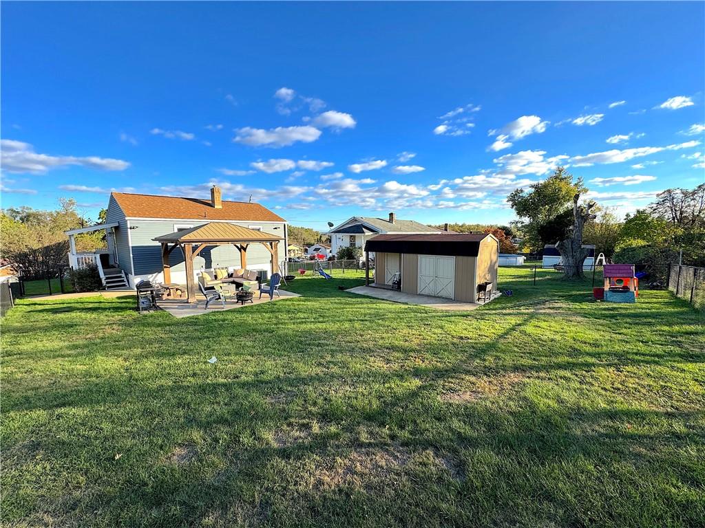 2030 Leo Street Irwin, PA 15642 - Photo 23 of 33 a view of a house with a big yard and a large tree