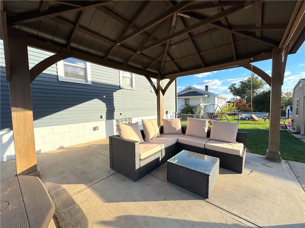 2030 Leo Street Irwin, PA 15642 - Photo 27 of 33 a outdoor space with patio the couches and pool table and chairs under an umbrella