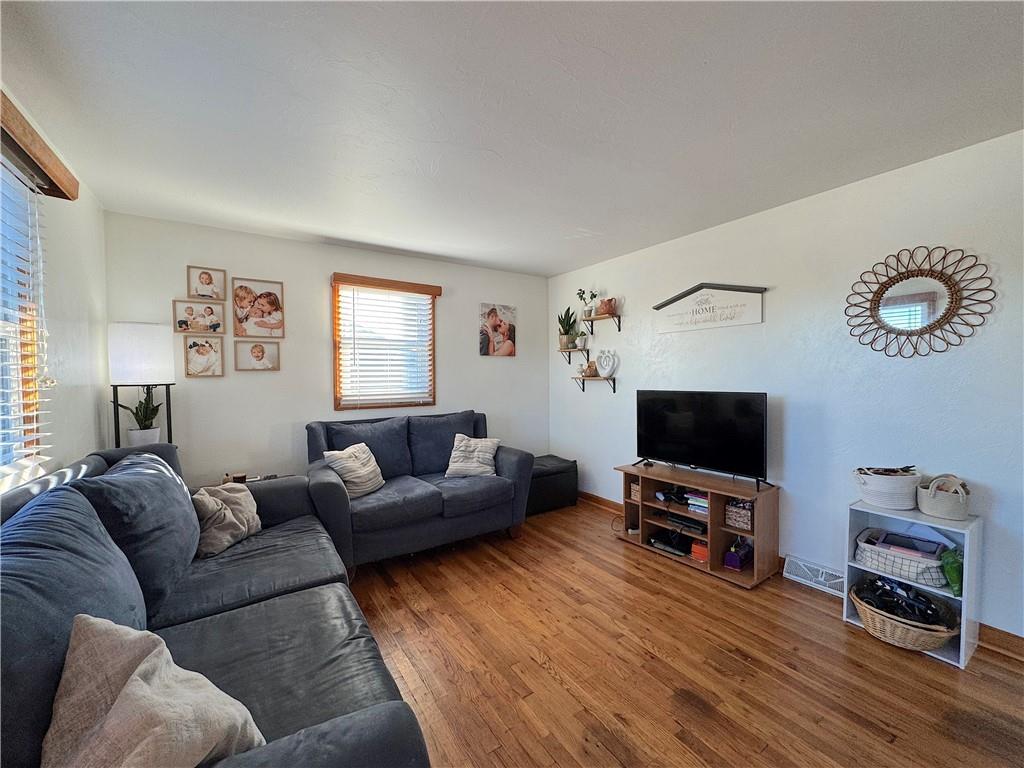 2030 Leo Street Irwin, PA 15642 - Photo 7 of 33 a living room with furniture and a flat screen tv