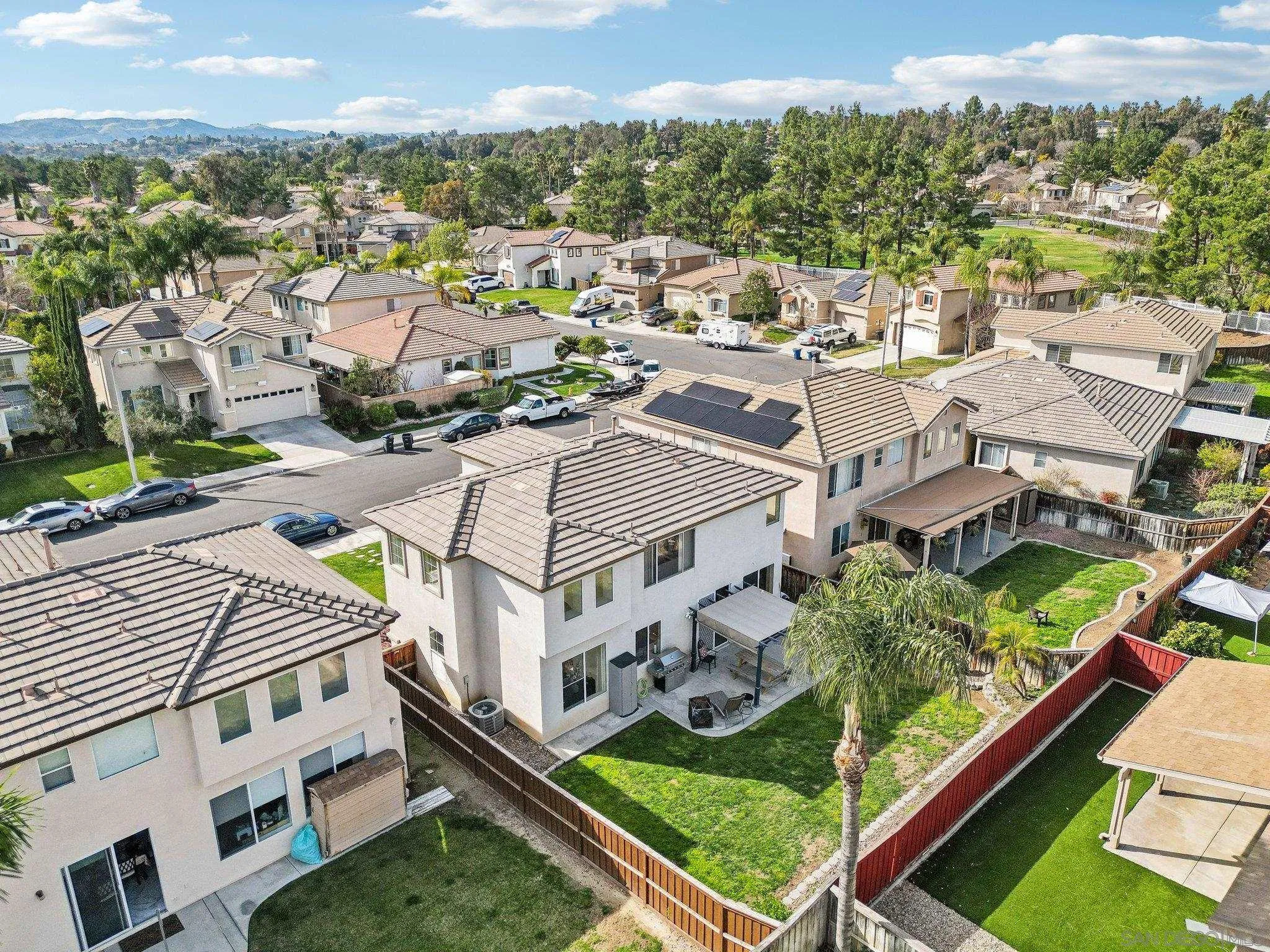 43166 Sereno Drive Temecula, CA 92592 - Photo 11 of 44 an aerial view of residential houses with yard and ocean view