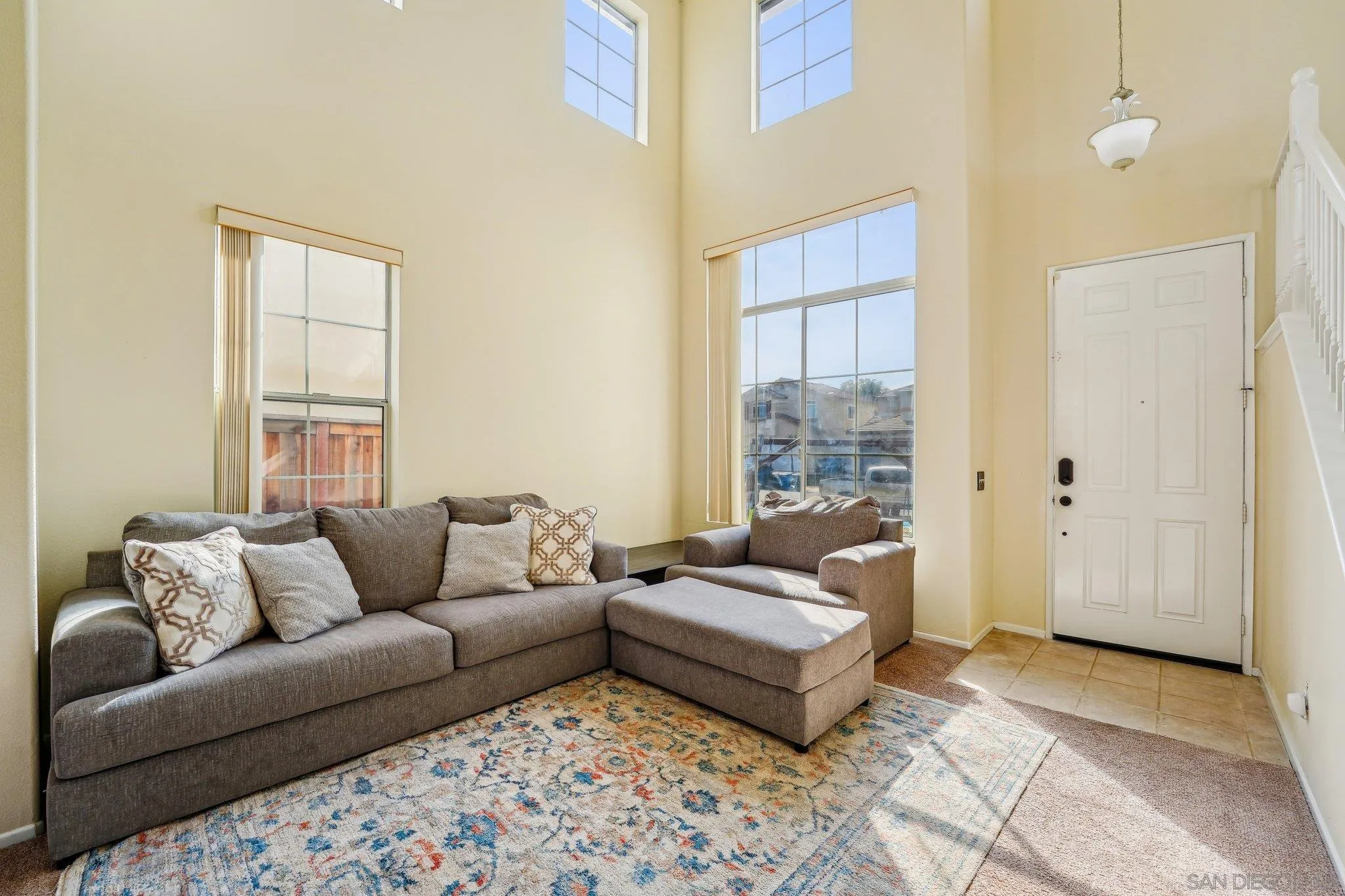 43166 Sereno Drive Temecula, CA 92592 - Photo 12 of 44 a living room with furniture and windows
