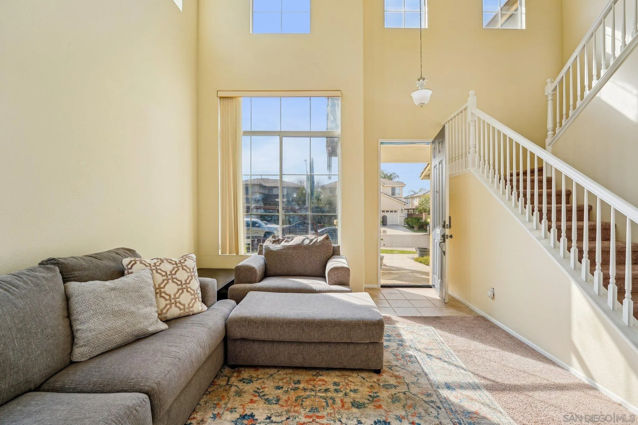 43166 Sereno Drive Temecula, CA 92592 - Photo 13 of 44 a living room with furniture and a rug