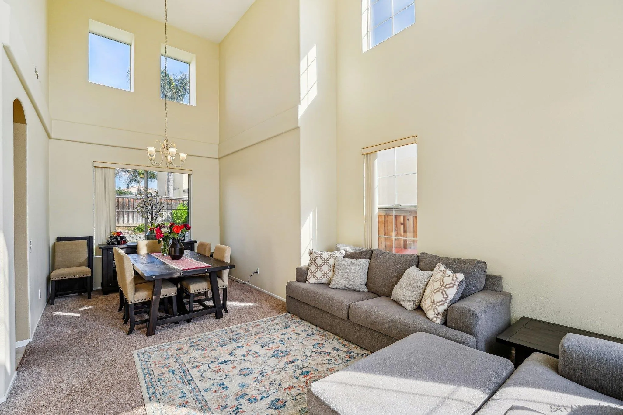 43166 Sereno Drive Temecula, CA 92592 - Photo 14 of 44 a living room with furniture and a chandelier