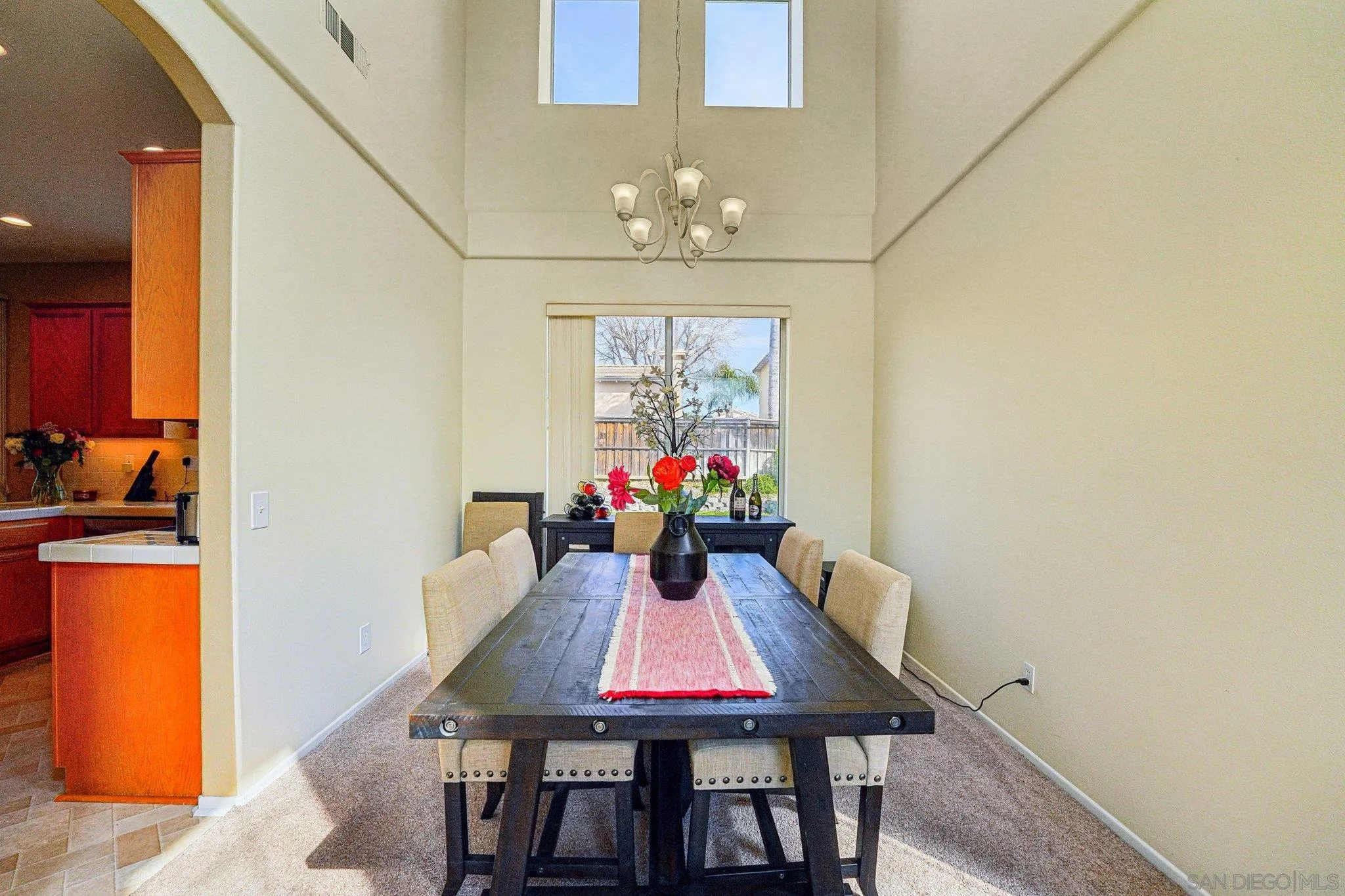 43166 Sereno Drive Temecula, CA 92592 - Photo 16 of 44 a view of a dining room with furniture and a chandelier