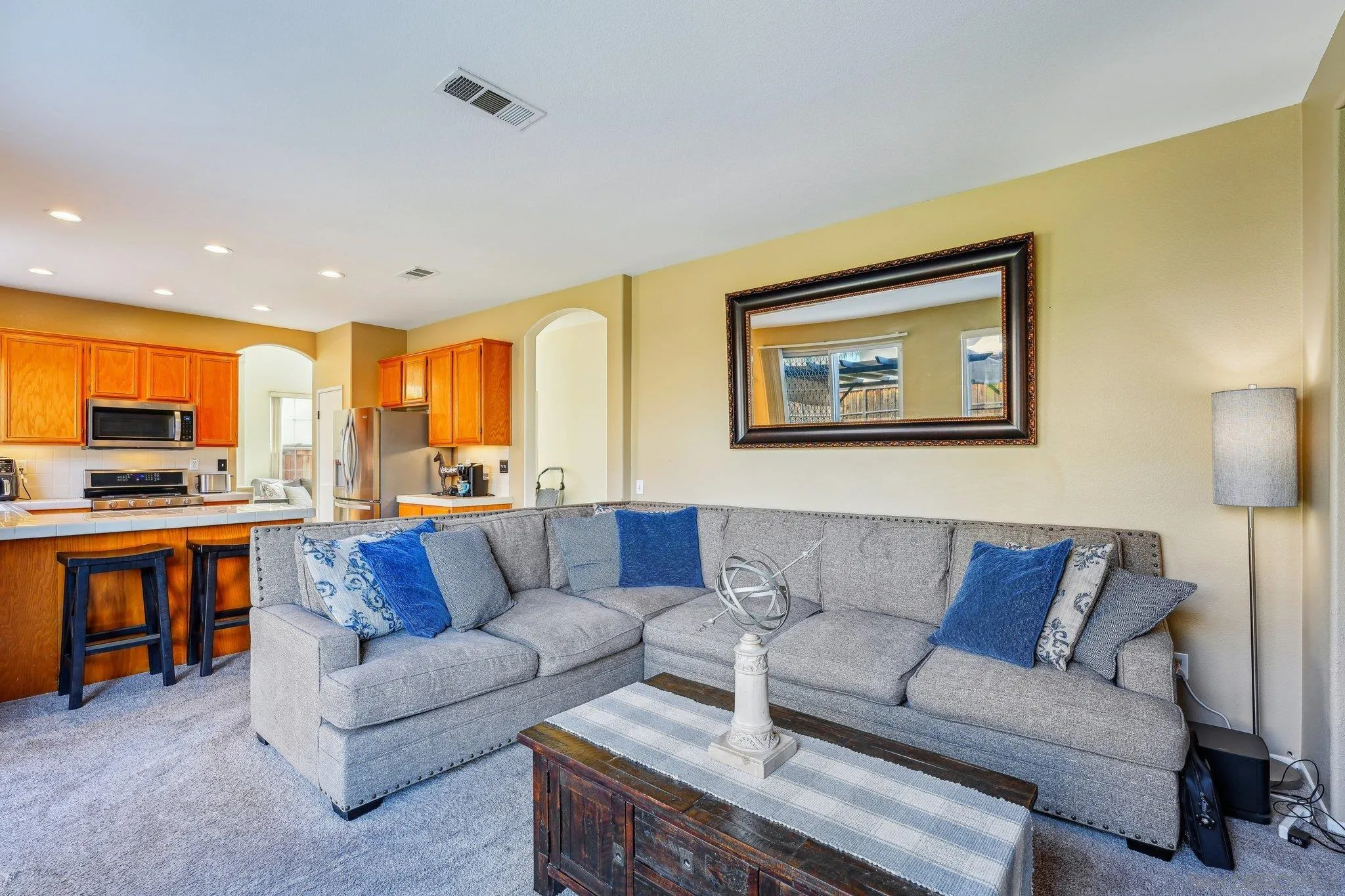 43166 Sereno Drive Temecula, CA 92592 - Photo 20 of 44 a living room with furniture kitchen view and a window